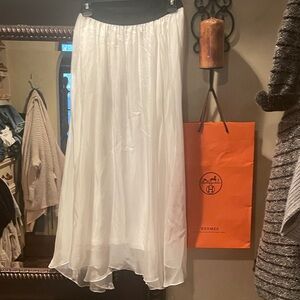 White 100% silk layered skirt / or strapless flowy dress. Black stretch waist.